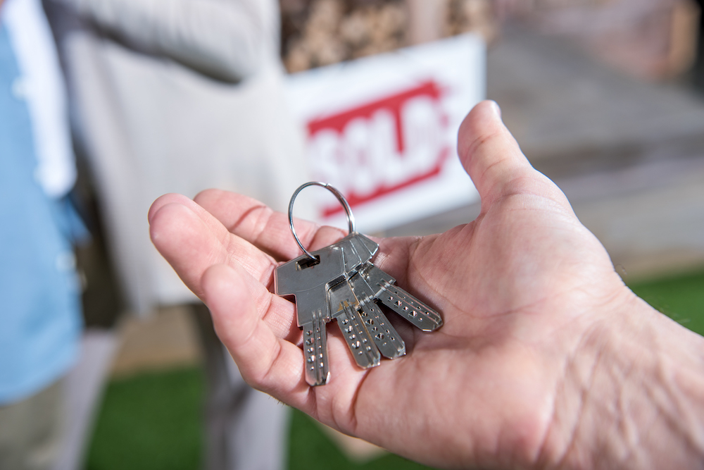 A man buys a home after searching for breckenridge homes for sale